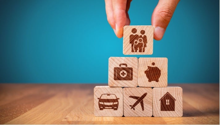 How are insurance rates determined - a stack of blocks relating to different kinds of insurance.