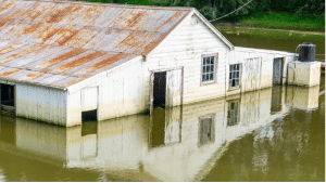 nsurance coverage for natural disasters - house flooded in rural area